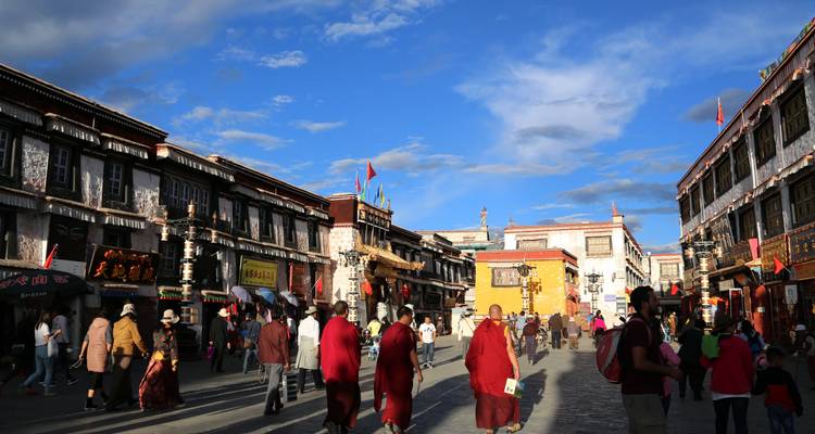 Busy street scene with traditional Tibetan architecture.