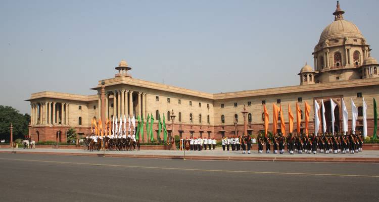 Parade happening in front of a large government building.