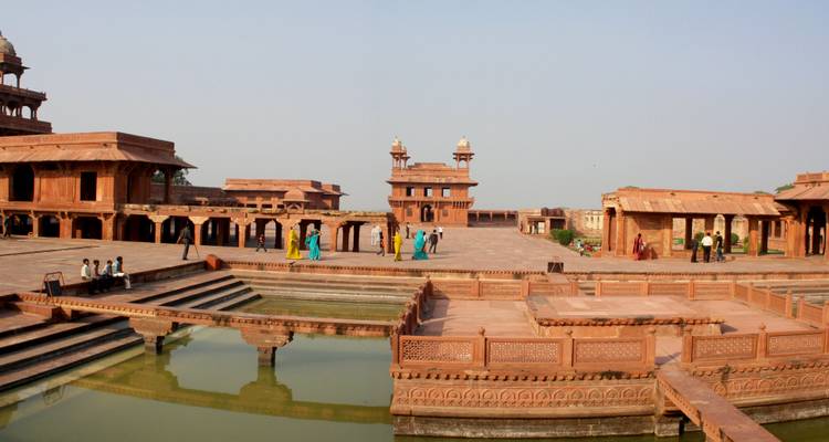 Open courtyard of a heritage site with a water feature.