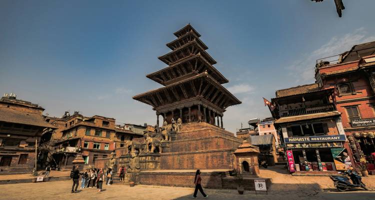 Bhaktapur Durbar Square with Nyatapola Temple and people walking around.