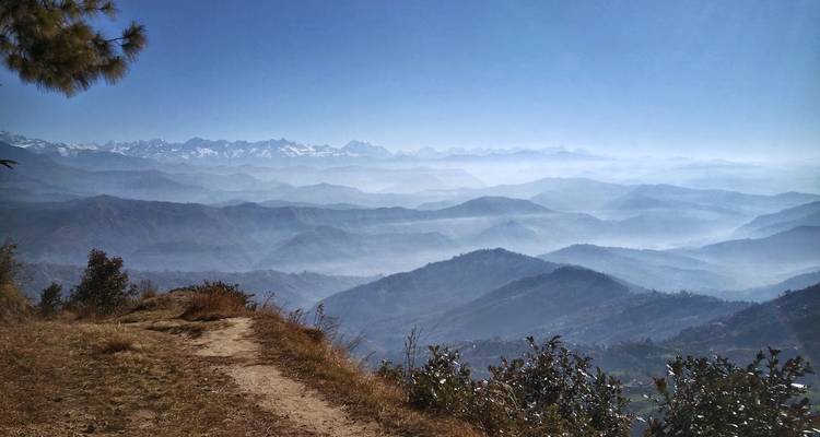 Panoramic view of mountain ranges covered in haze.