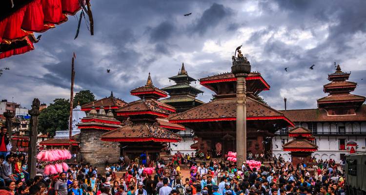 Crowded temple area with traditional rooftops.