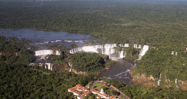 Aerial view of lush forest with the majestic Iguazu Falls.