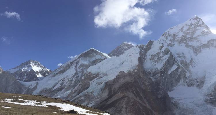 A close-up view of snow-covered peaks against the clear sky.