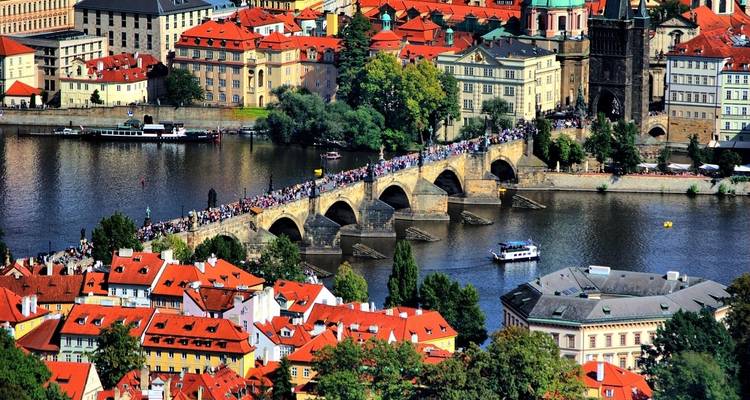 Aerial view of a bridge over a river crowded with people.