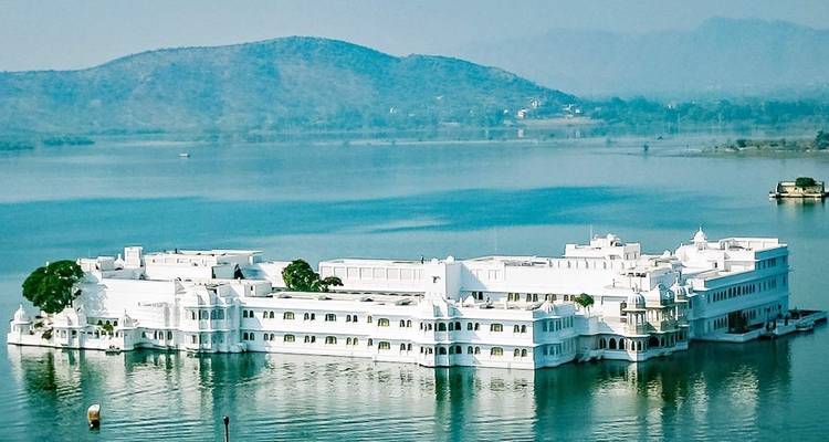 Lake with a white palace surrounded by water.