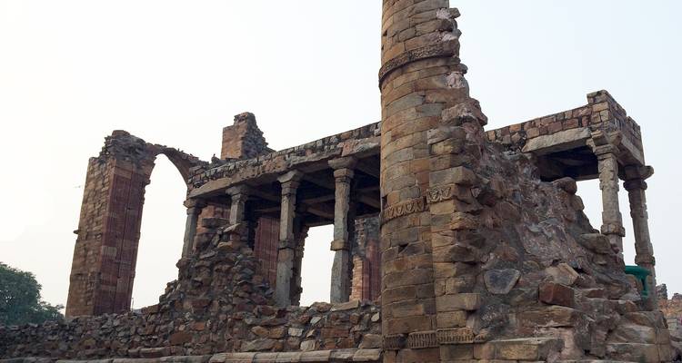 Ruins of an ancient stone structure with pillars.