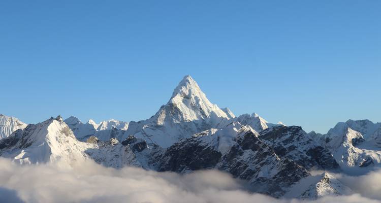 Snow-capped mountain peaks under a clear sky.