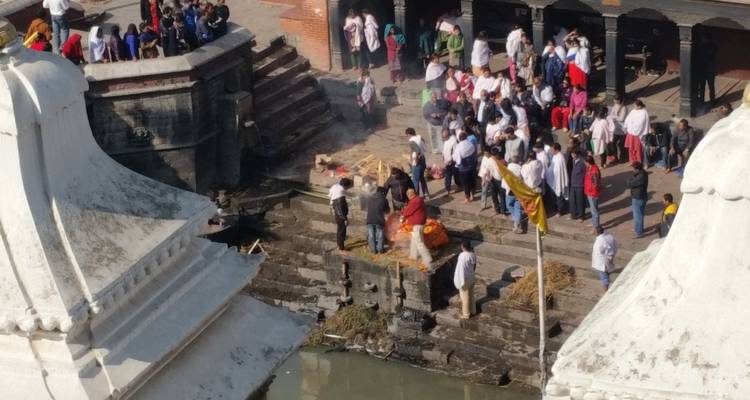 Cremation ceremony taking place on the ghats beside the Bagmati River at Pashupatinath