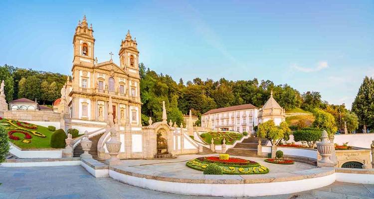 Bom Jesus do Monte Sanctuary with ornate stairways and flower beds at dawn light