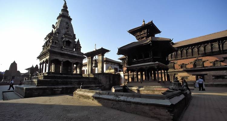 Group of people near traditional temples during the day.