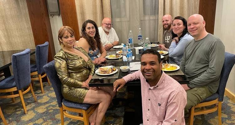 Group of people having a meal together indoors.