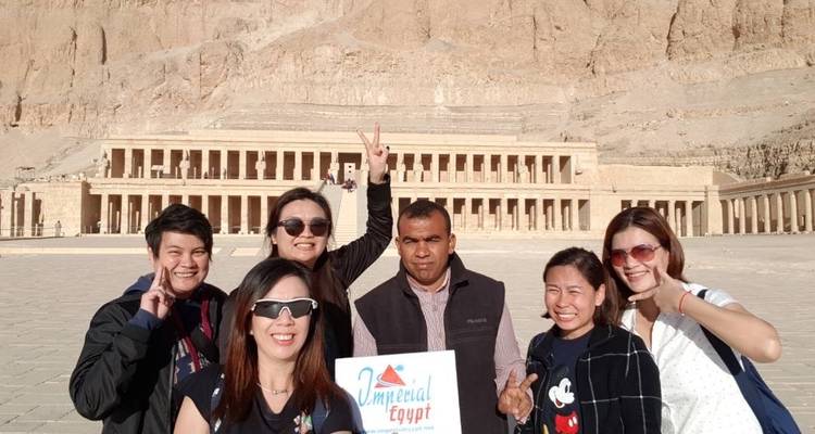 Group standing in front of an Egyptian temple.