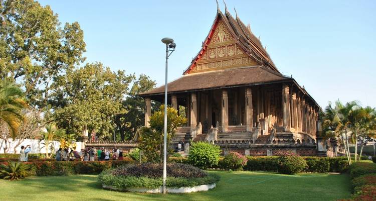Historic temple with visitors and greenery