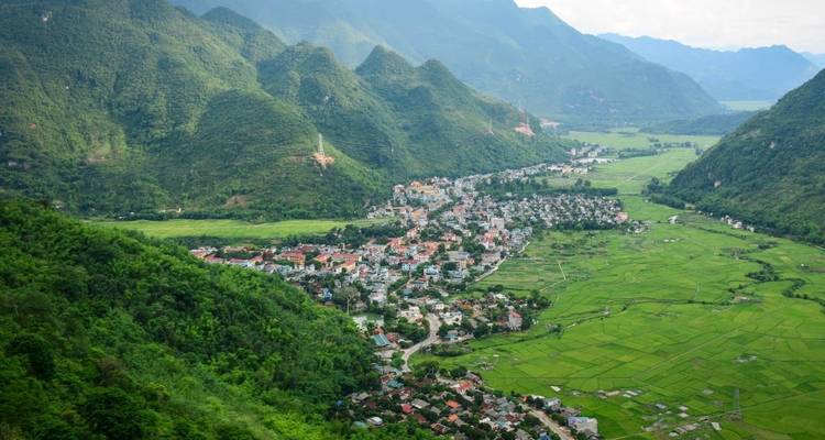 Aerial view of Mai Chau town nestled among emerald rice paddies and lush hills
