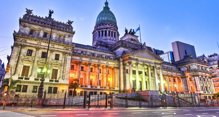 Iconic government building illuminated at night.