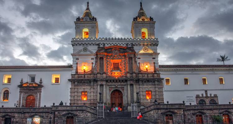 Saint Francis Church in Quito, Ecuador, illuminated at dusk.