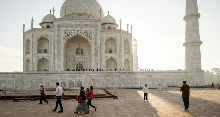 People walking near the Taj Mahal.