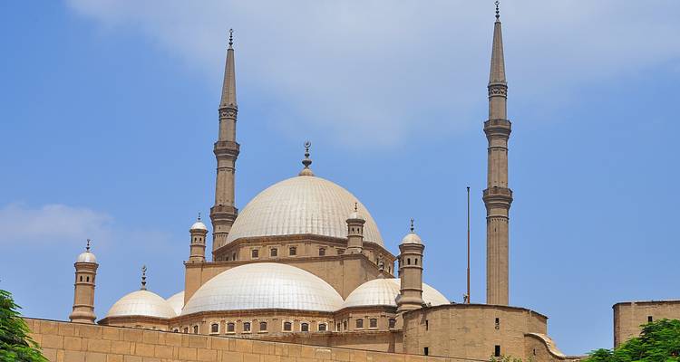 View of a mosque with prominent minarets.