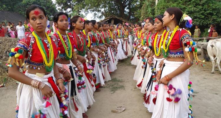 Group of women in traditional attire in a cultural dance.