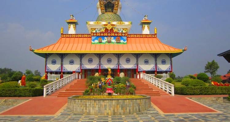 Ornate temple with a large golden dome and colorful details.