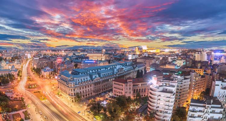 Bucharest at sunset with a colorful sky.