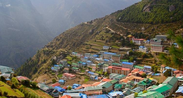 Aerial view of a hillside village.