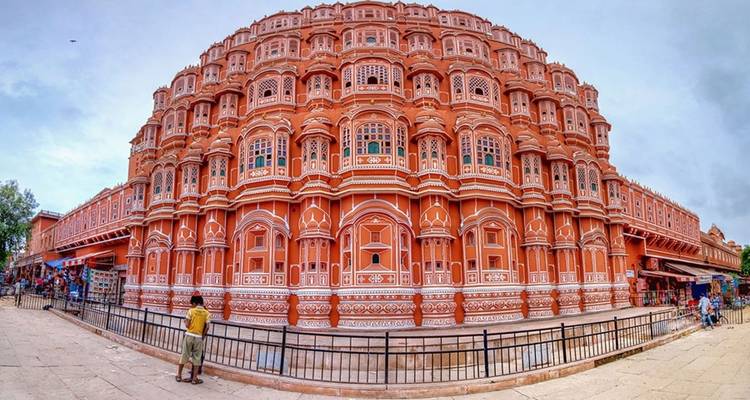 Hawa Mahal with people walking nearby.