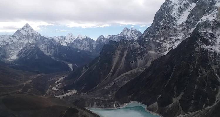 Mountain range with snow-dusted peaks.
