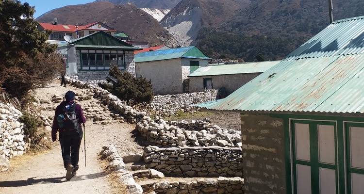 Person walking in a small mountain village.