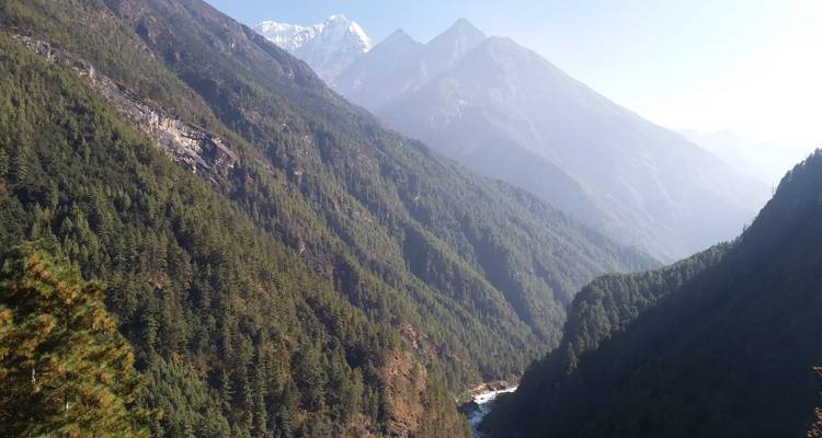 Mountainous valley with a river running through.