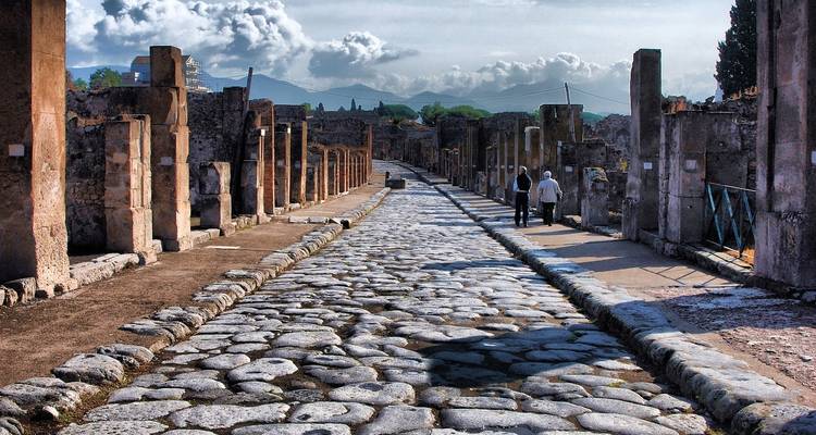 Ancient streets of Pompeii with ruins visible.