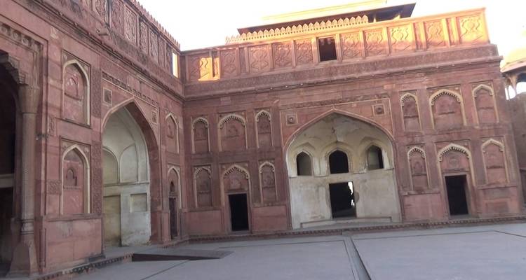 Interior courtyard of a historical red sandstone building.