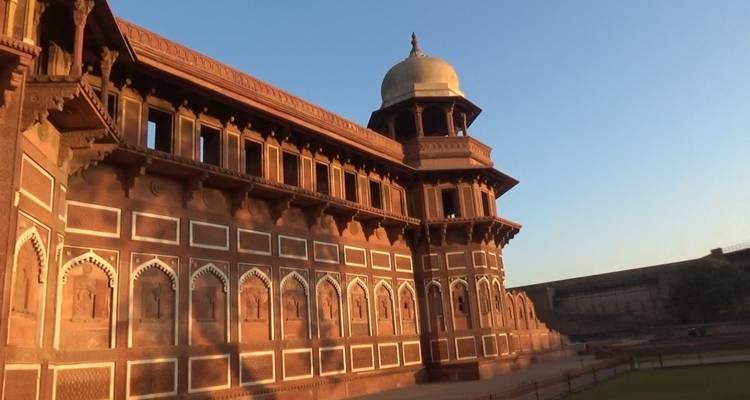 Sunlit facade of an ancient sandstone fort.