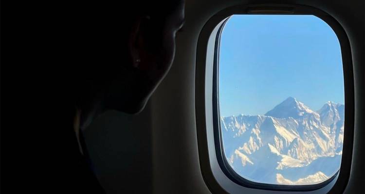 View from airplane window of mountains.