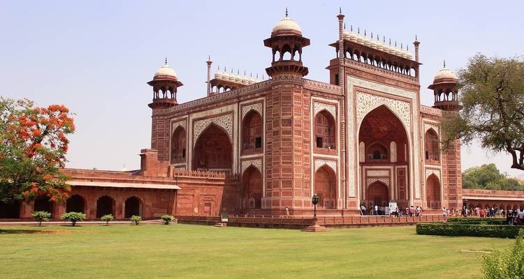 Red sandstone building with arched entrances.