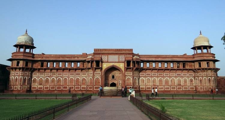 Front view of a monumental red sandstone fort.