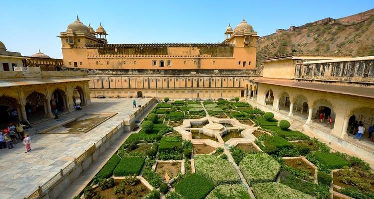 A courtyard within a historic fort with manicured gardens