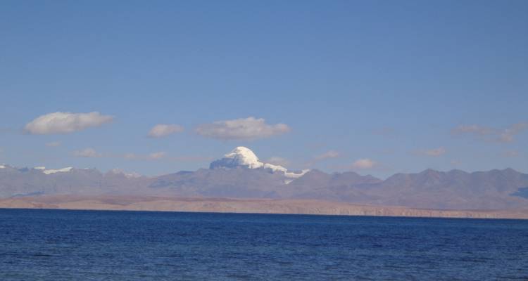 Distant mountains with a large body of water in the foreground.