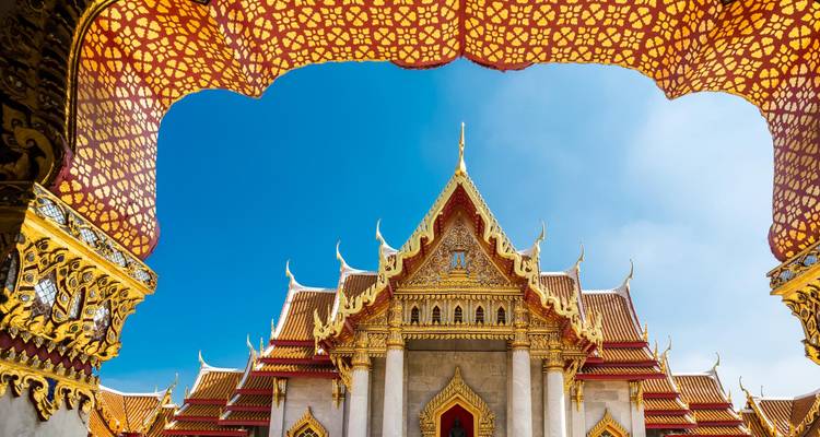 Ornate temple architecture with a blue sky backdrop.