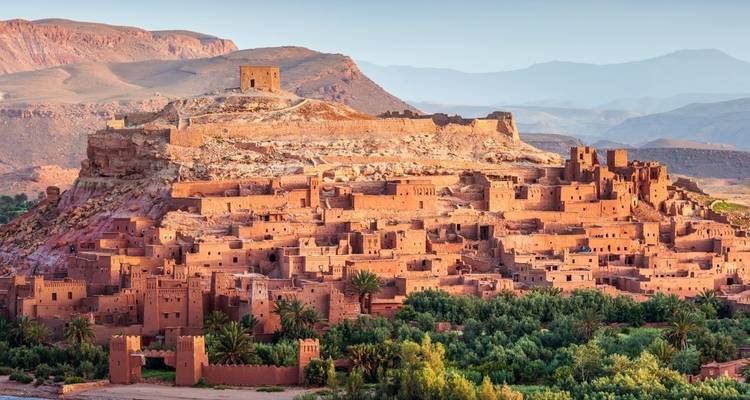 Fortified village known as Ait Benhaddou with surrounding landscape.