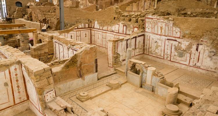 Ancient ruins with intricate wall paintings and mosaics