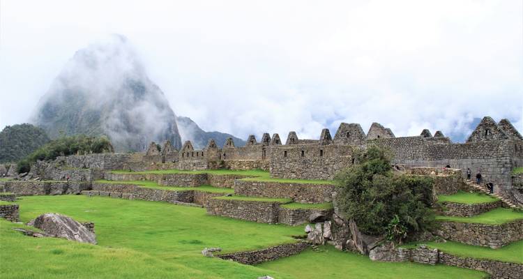 Ruins with misty mountains in the background.