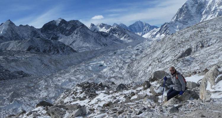 Hiker in a snowy mountainous landscape.