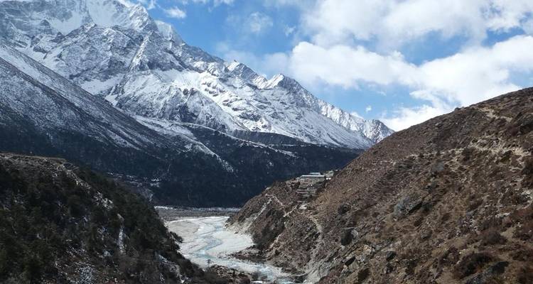 Snow-covered mountains with a winding river.