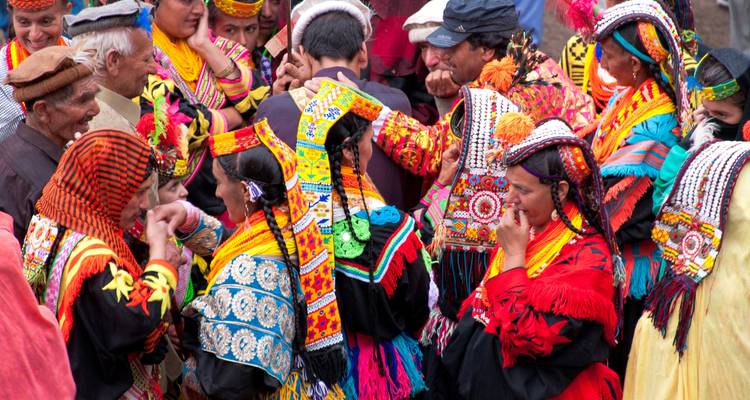 Festive gathering with people in colorful costumes.