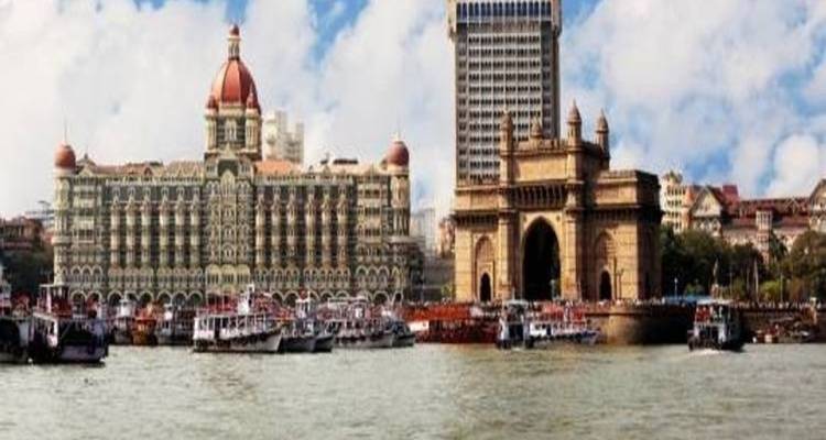 View of the Gateway of India and surrounding buildings from the water.