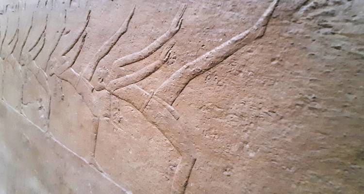 Ancient relief carvings on a stone wall.