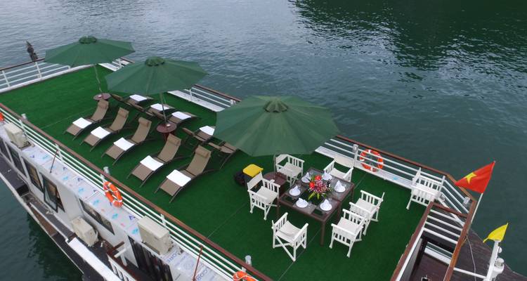 Deck of a cruise ship with deck chairs and umbrellas.