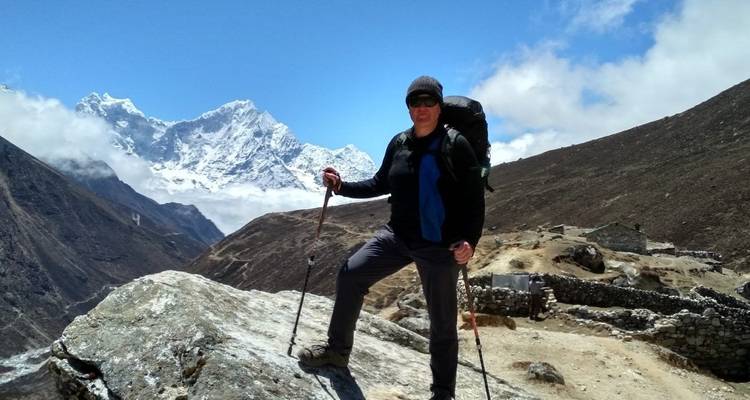 A person hiking in a mountainous landscape.